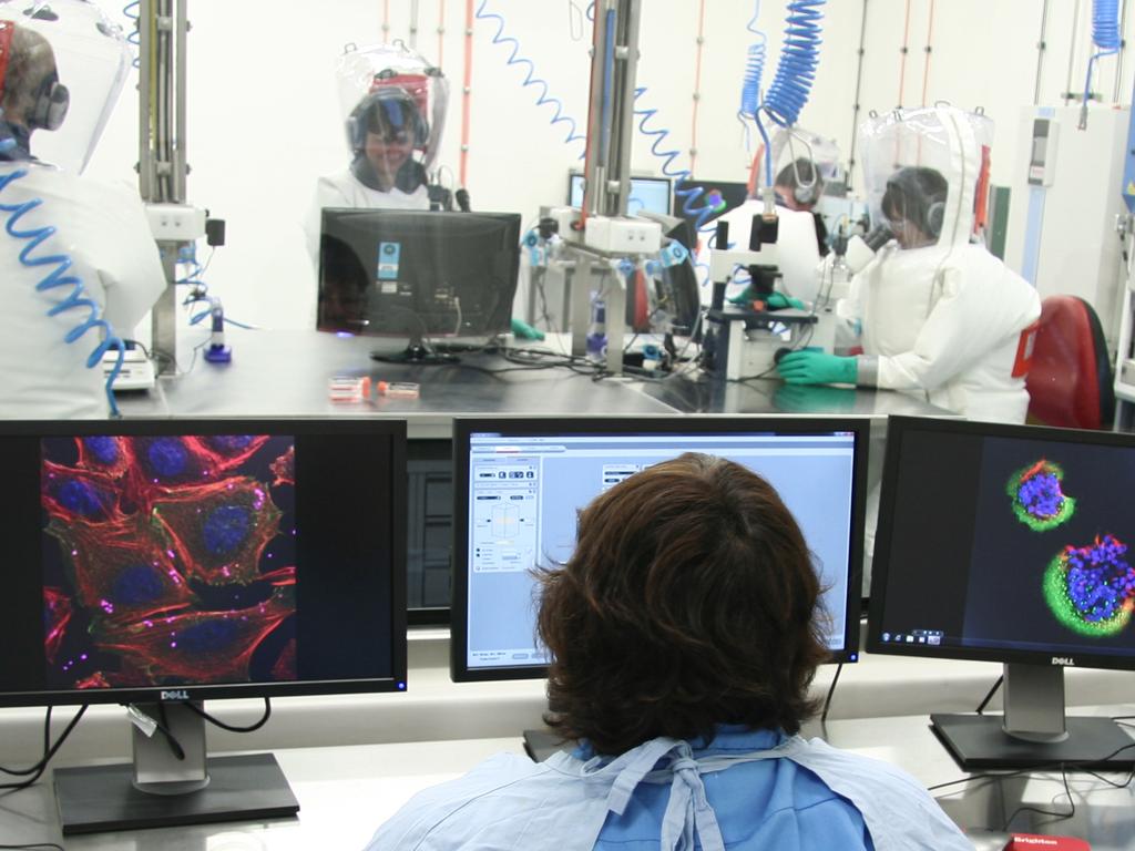 Scientists working in the secure area at CSIRO’s Australian Animal Health Laboratory.