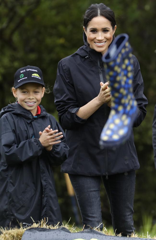 Meghan Markle nailed the gumboot-throwing contest. Picture: AP Photo/Kirsty Wigglesworth