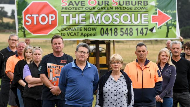 Terry and Karen Ryan with other concerned residents on the Ryan property in Narre Warren North voicing concerns about a proposed mosque in the paddock neighbouring their property.