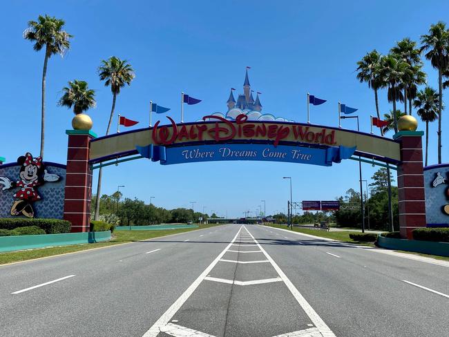 An empty road leads into a deserted Disney resort after it was closed. Picture: AFP d