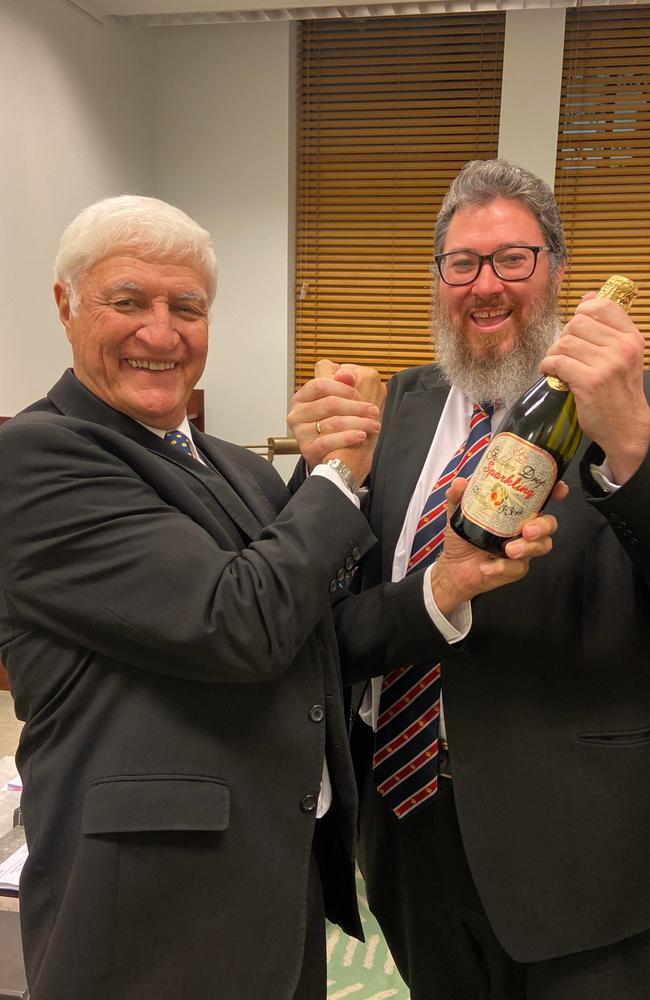 Kennedy MP Bob Katter and Dawson MP George Christensen celebrate the reinsurance pool passing.