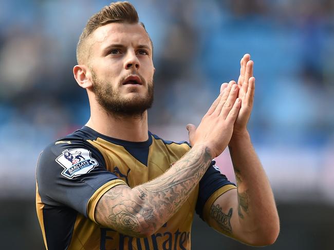 (FILES) This file photo taken on May 08, 2016 shows Arsenal's English midfielder Jack Wilshere applauding fans after the English Premier League football match between Manchester City and Arsenal at the Etihad Stadium in Manchester, north west England. Jack Wilshere's fall from grace shows no sign of slowing as the Arsenal midfielder made a shock move to Bournemouth on a season-long loan on August 31, 2016. Wilshere was once regarded as one of the most promising youngsters in the Premier League, but Gunners manager Arsene Wenger has allowed the 24-year-old to leave the Emirates Stadium in a bid to revitalise his career. / AFP PHOTO / PAUL ELLIS