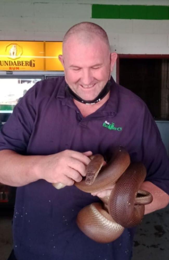 Goldfields Hotel Motel general manager Jason Grove with the pub's famous pet snake. Picture: Facebook