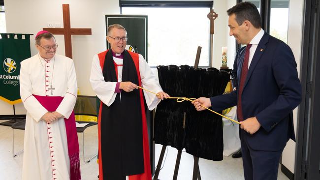 Catholic Archbishop Patrick O'Reagan and Anglican Archbishop Geoffrey Smith (centre) unveiled the commemorative plaque alongside Education Minister Blair Boyer (right) during the opening ceremony. Picture: Supplied