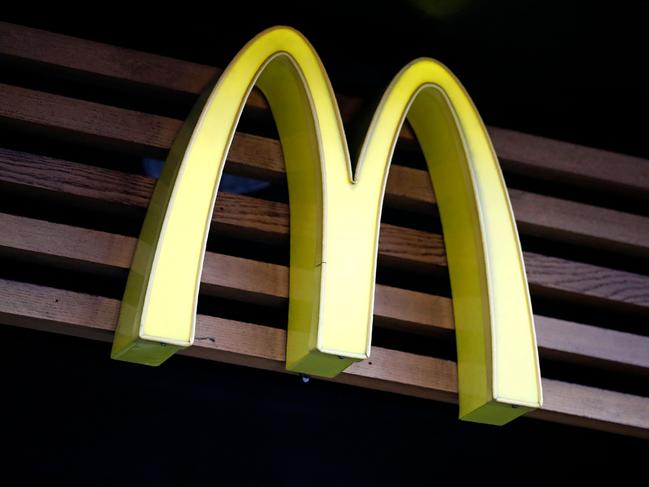 (FILES) In this file photo taken on September 04, 2017 a logo of US burger chain McDonalds is pictured above a branch of the fast food restaurant in central London. - McDonald's reported January 31, 2023 a jump in fourth-quarter profits following higher sales in most markets, scoring with consumers worried about inflation. (Photo by Tolga AKMEN / AFP)