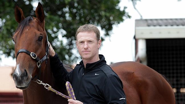 Former Socceroos captain Craig Moore with his Group 1-winning gelding Buffering. Picture: Nathan Richter 