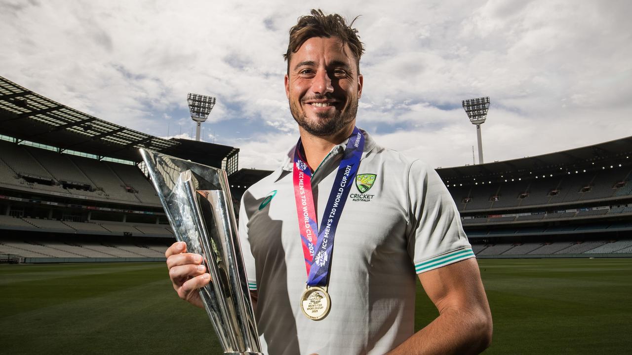 Marcus Stoinis shows off the T20 World Cup at the MCG.