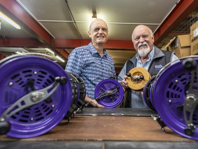 Glenn and Bruce Alvey, in the workshop where their famous Alvey fishing reels are made.  L-r) Pictured are Glenn and Bruce Alvey. Glenn is holding one of their current off shore 82 series model & Bruce is holding one of companyÃ¢â&#130;¬â¢s earlier fishing reels that they made.