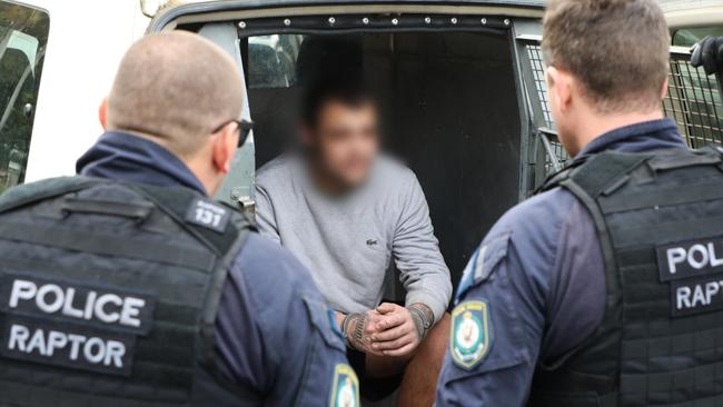 Raptor Squad officers make an arrest during raids under Strike Force Strike Force Racewyn, established to investigate the alleged theft of firearms from regional properties in the Port Macquarie area. Picture: NSW Police