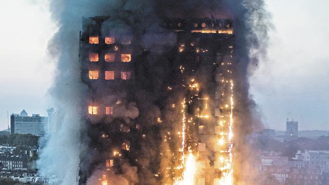 The inferno in the Grenfell Tower rages as dawn breaks in London. Picture: Jeremy Selwyn