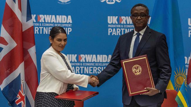 British Home Secretary Priti Patel and Rwandan Minister of Foreign Affairs and International Cooperation Vincent Biruta, shake hands after signing an agreement in Kigali, Rwanda. Asylum seekers arriving in the UK will be sent to Rwanda. Picture: AFP