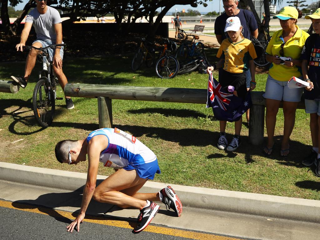 Callum Hawkins falls to his knees for the first time.