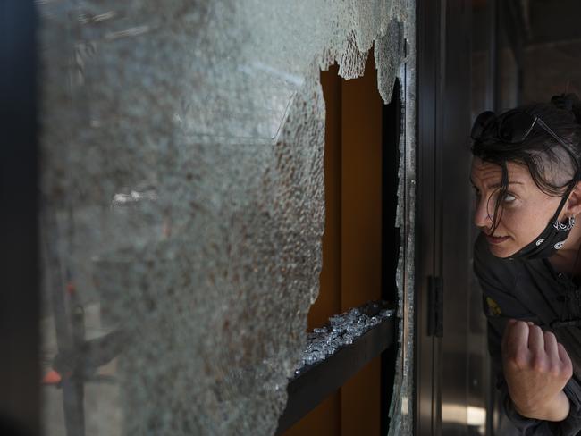 A business window hit by bullets in Minneapolis. Picture: AP