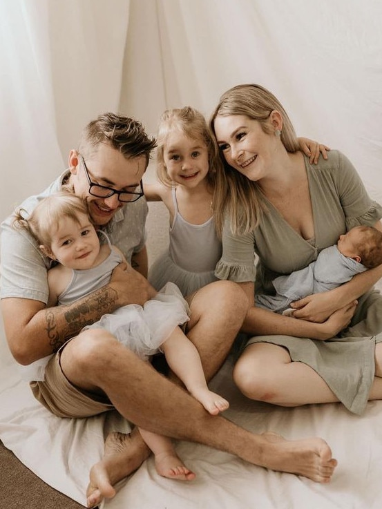 Brendan Tyrrell and his wife Aliesha with their young children.