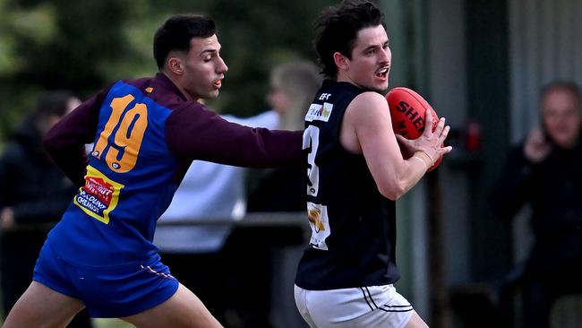 NFL: Banyule’s Arben Dani tries to catch Epping’s Damon Marcon. Picture: Andy Brownbill