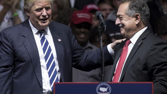 Donald Trump introduces Andrew Liveris in Michigan on Saturday.