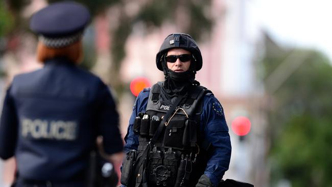 Heavily-armed police on Wright St during the stand-off with Rodney Clavell. Picture: Tom Huntley