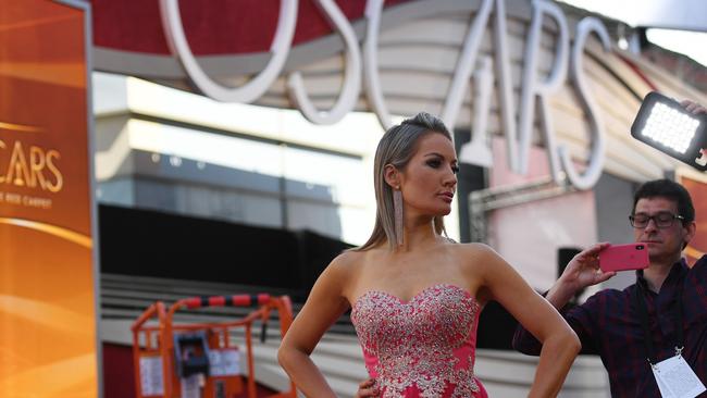 Journalists and presenters prepare on the red carpet area for this year's Oscars Awards ceremony in Hollywood. Picture: AFP