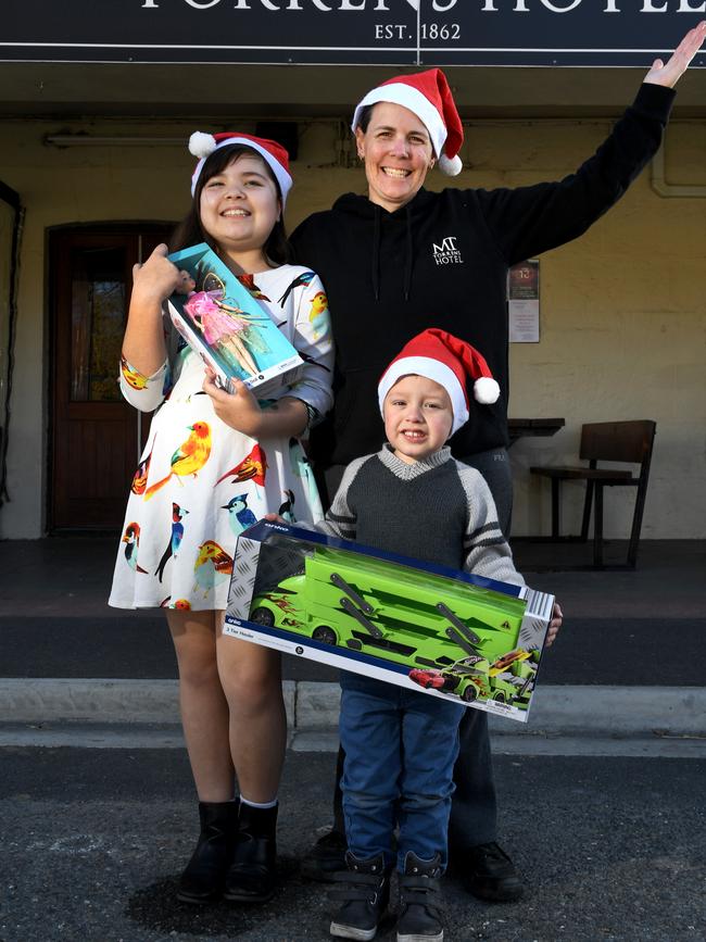 Publican Angie Lo-Faro, with Nadia, 10, and Maxwell, 4, is helping to co-ordinate a special Christmas in July for families affected by the Cudlee Creek bushfire. Picture: Tricia Watkinson