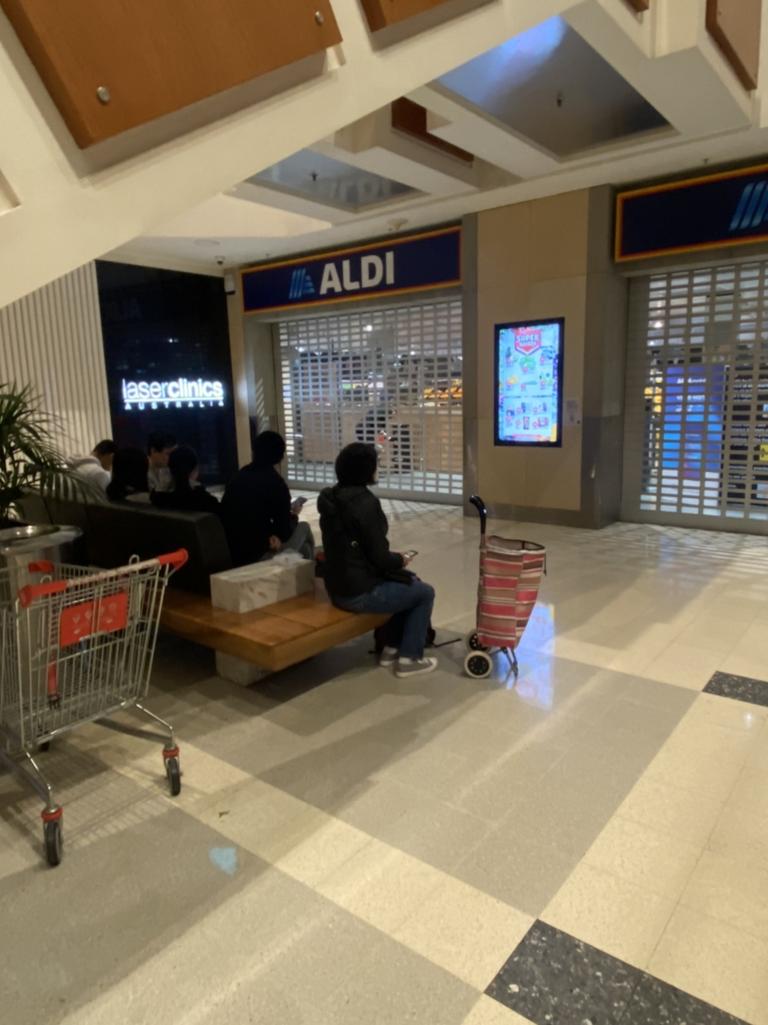 A small group of shoppers arrived at 6.30am in anticipation for massive lines. But were pleasantly surprised by the lack of shoppers. Picture: Vanessa Brown/news.com.au