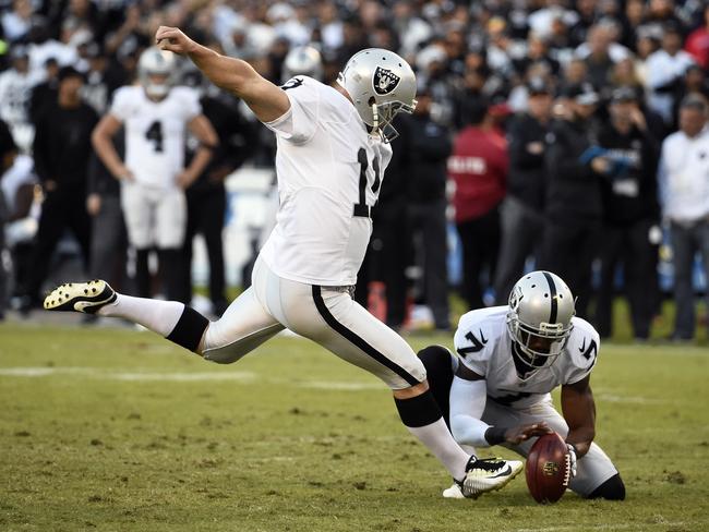 Oakland Raiders kicker Sebastian Janikowski kicks a field goal.