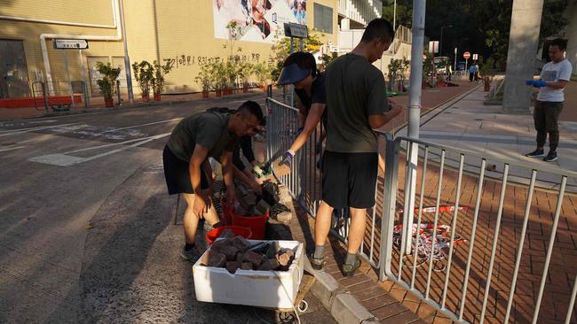 Hong Kong’s PLA soldiers have become more visible – during the 2019 protests they cleared debris from the streets. Picture: AFP