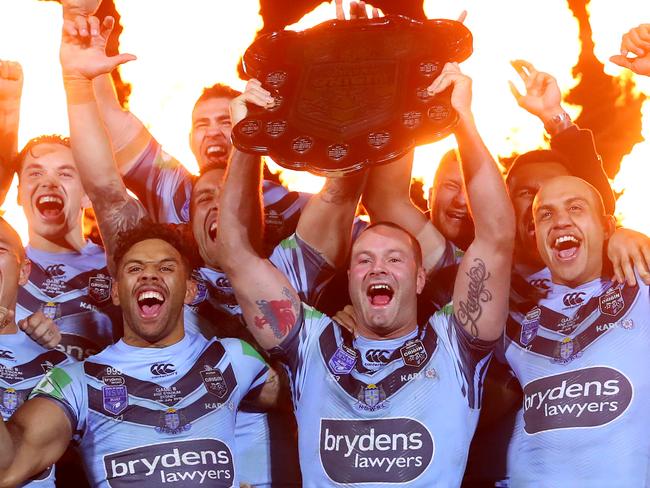 SYDNEY, AUSTRALIA - JULY 10: Boyd Cordner of the Blues and team mates celebrate with the State of Origin trophy after winning the series and winning game three of the 2019 State of Origin series between the New South Wales Blues and the Queensland Maroons at ANZ Stadium on July 10, 2019 in Sydney, Australia. (Photo by Cameron Spencer/Getty Images)