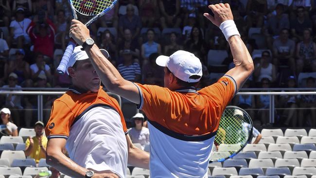 United States' Bob, left, and Mike Bryan celebrate after winning their men's doubles match against Max Mirnyi of Belarus and Austria's Phillip Oswald. Photo: AP