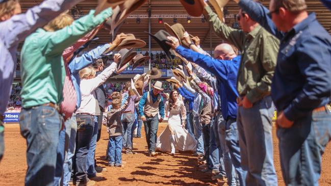 The cowboy guard of honour for Kyla Dolen and Fred Osman married on the famous red dirt of the Mount Isa Mines main area before Fred defends his title in the Open. Picture: Pete Wallis