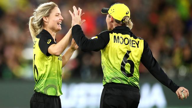 Nicola Carey celebrates with Beth Mooney of Australia dismissing Deepti Sharma of India during the ICC Women's T20 Cricket World Cup Final. Picture: CAMERON SPENCER/GETTY IMAGES