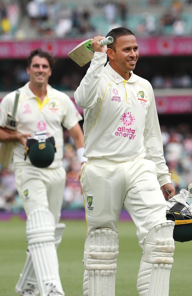 Usman Khawaja after his century leads the field at tea to the applause of his captain during the 4th Ashes Test match between Australia and England in January. Picture: Phil Hillyard