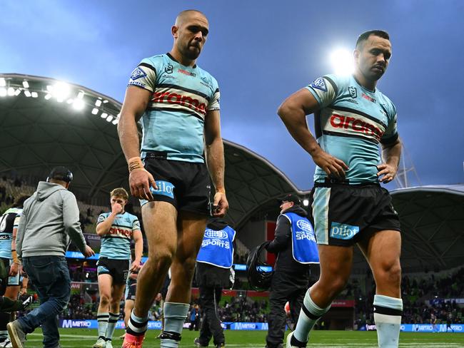 Dejected Sharks William Kennedy and Braydon Trindall walk from AAMI Park. Picture: Quinn Rooney/Getty Images