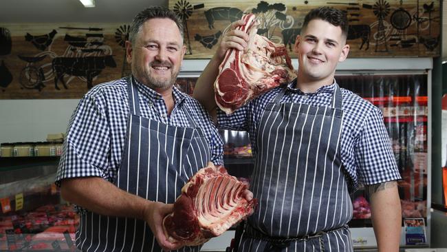 Todd McFarland and his son Angus, 22, at their butchery, McFarland's Quality Meats said it is “getting tougher” to hold out passing the extra costs to customers. Picture: David Swift