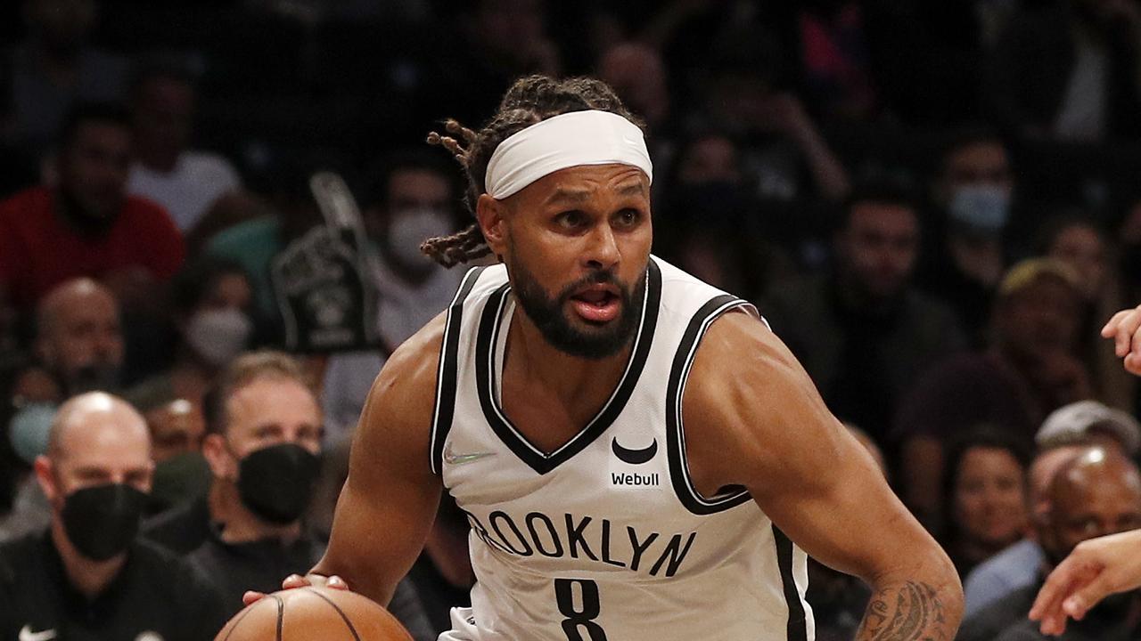 NEW YORK, NEW YORK - OCTOBER 08: (NEW YORK DAILIES OUT) Patty Mills #8 of the Brooklyn Nets in action against the Milwaukee Bucks at Barclays Center on October 08, 2021 in New York City. The Nets defeated the Bucks 119-115. NOTE TO USER: User expressly acknowledges and agrees that, by downloading and or using this photograph, user is consenting to the terms and conditions of the Getty Images License Agreement. (Photo by Jim McIsaac/Getty Images)