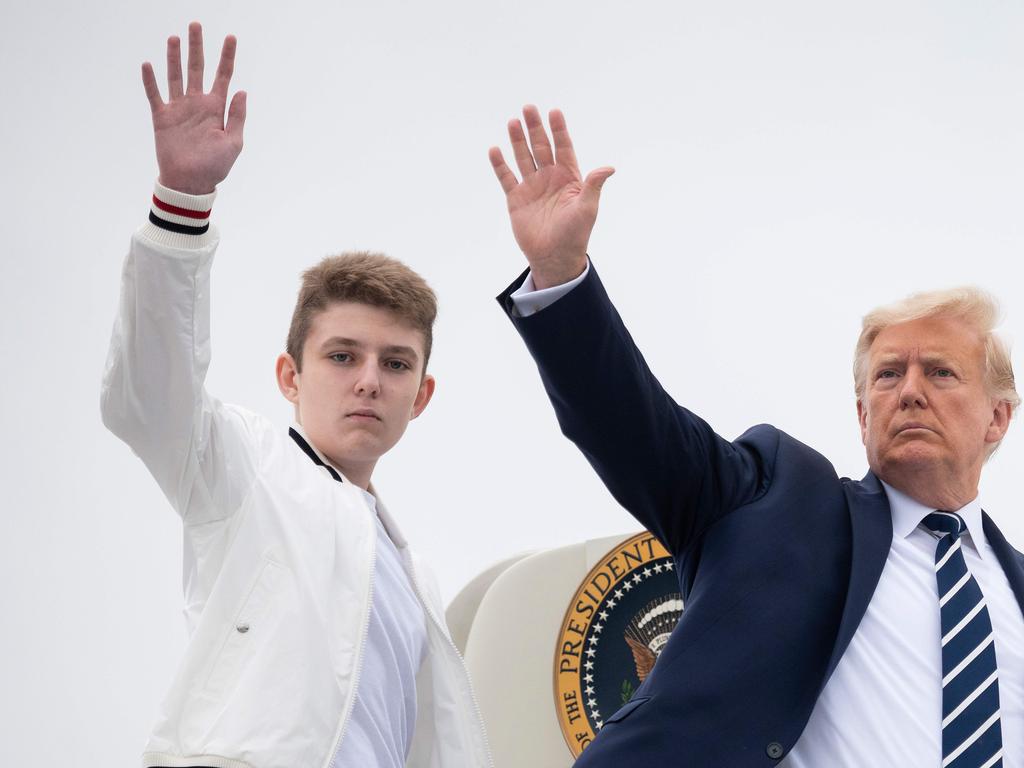 US President Donald Trump and his son Barron wave as they board Air Force One at Morristown Municipal Airport in Morristown, New Jersey. Picture: Jim Watson/AFP