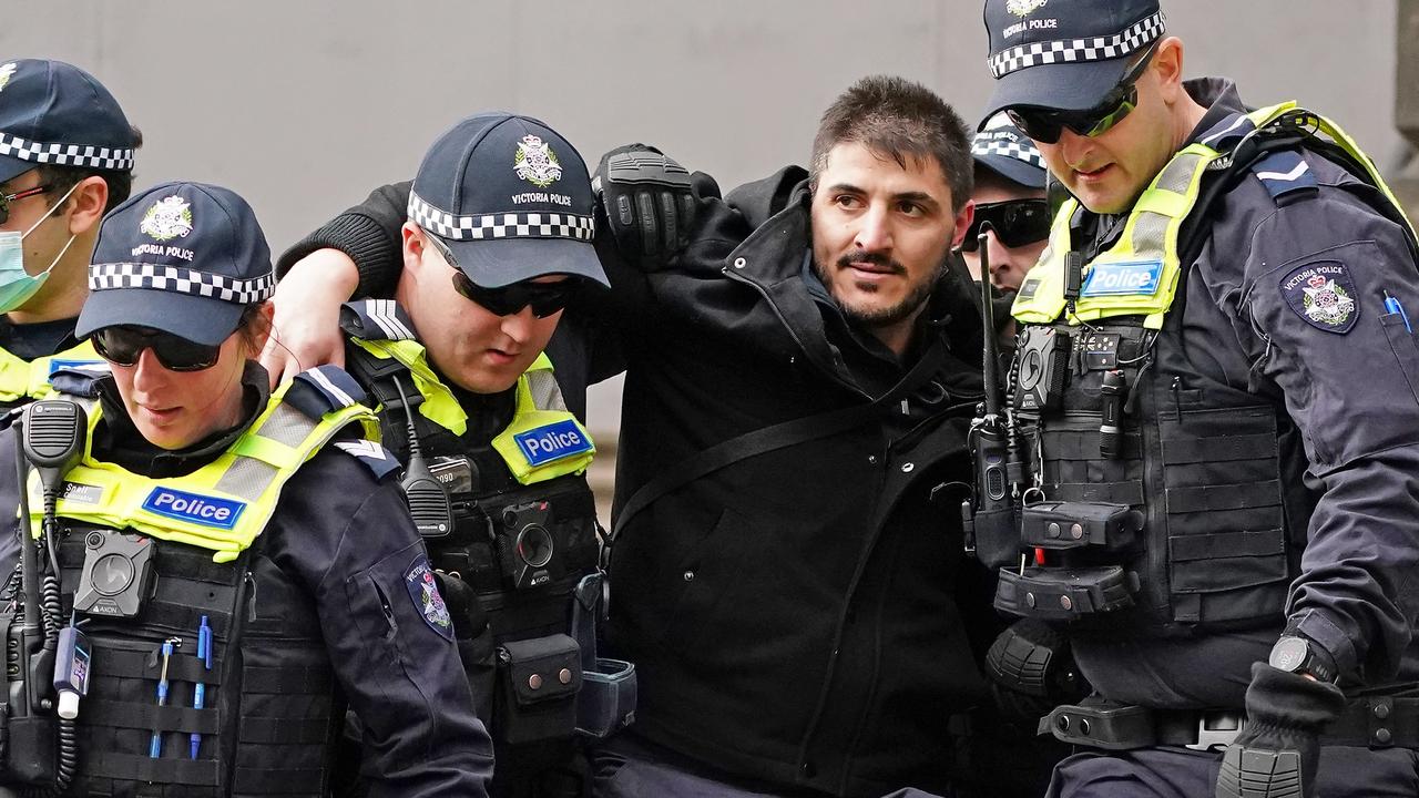 Fanos Panayides is arrested by police at an anti-lockdown protest in Melbourne on May 10. Picture: AAP/Scott Barbour