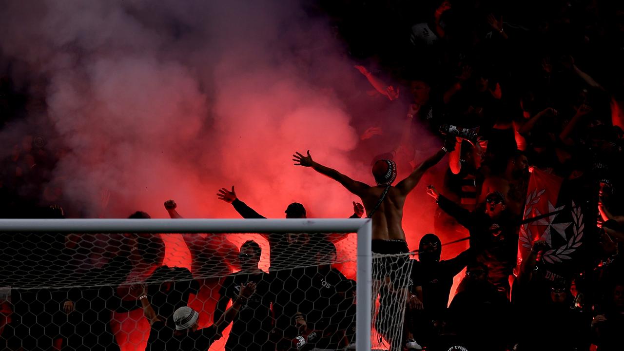 Wanderers fans let off a flare during the round 18 A-League Men match between Sydney FC and Western Sydney Wanderers at Allianz Stadium. Photo by Brendon Thorne/Getty Images