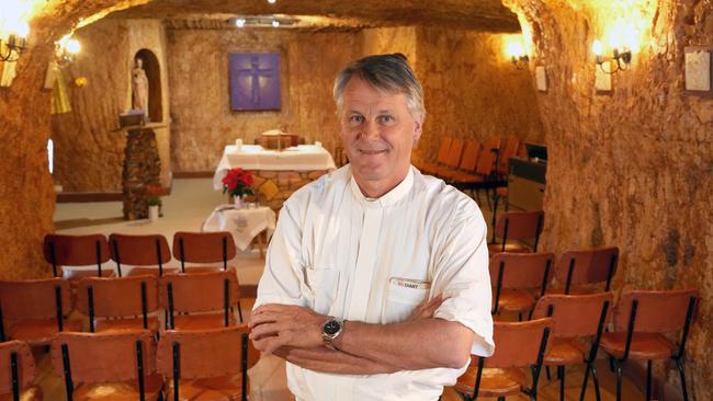 Father Paul Crotty in the ornate underground Catholic church. Picture: Dean Martin