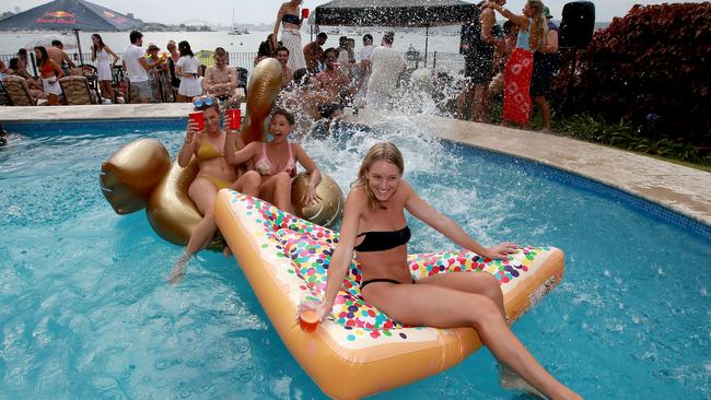 L-R Georgia Mandalidis, Antonia Seale and Biance Seale get ready for NYE at their apartment building pool in Rose Bay. Picture: Toby Zerna