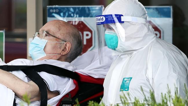Residents are taken away from CraigCare aged care in Pascoe Vale in medical transport. Tuesday, August 4, 2020. Picture: David Crosling