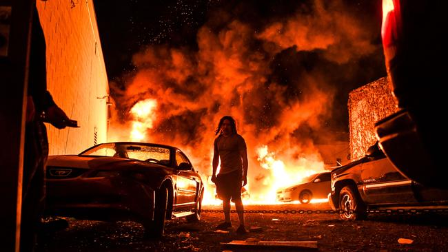 Cars on fire in a parking garage in Minneapolis, Minnesota. Picture: AFP