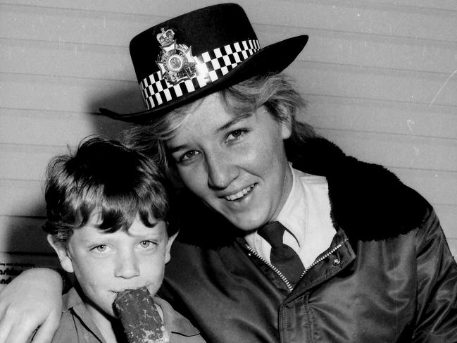 Good with kids: the then Constable Katarina Bosnjak with a lost boy at the Ekka in 1986.