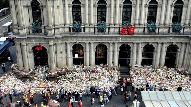 A sea of flowers laid in tribute to victims of the Bourke St massacre. Picture: Nicole Garmston