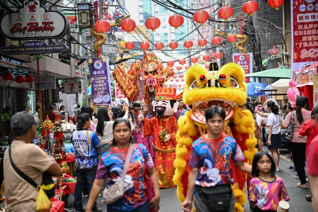 Prayer and dance: hundreds of millions in Asia celebrate Year of the Snake