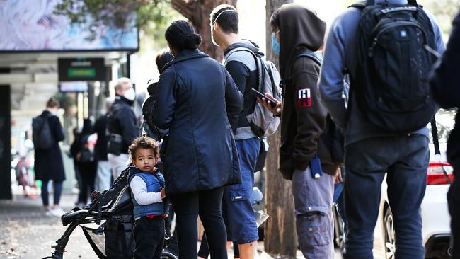 Long lines of financially struggling workers grow outside the Darlinghurst Centrelink. Picture: Jane Dempster/The Australian.