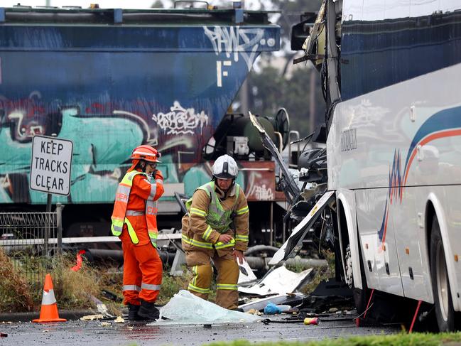 A bus collided with a freight train or a signal post at the Station St rail crossing at North Shore Train station. Picture: Alison Wynd