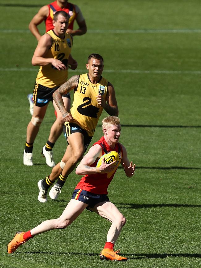 John Noble of the SANFL runs with the ball during the state game between WA and SA at Optus Stadium. Picture: Paul Kane/Getty Images