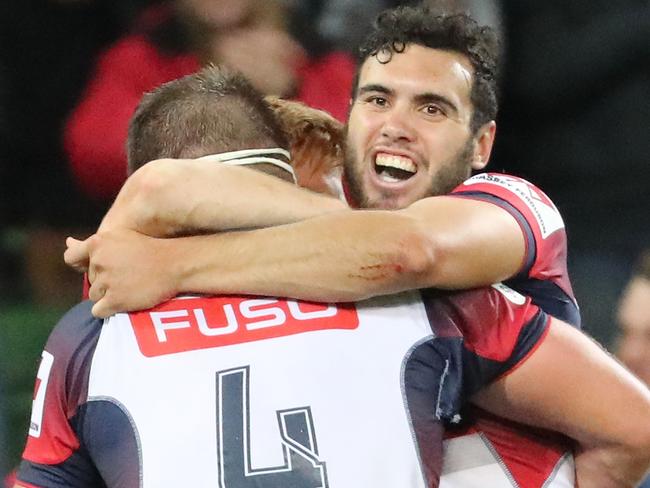 MELBOURNE, AUSTRALIA - APRIL 15:  Nic Stirzaker , Steven Cummins and Jack Debreczeni of the Rebels celebrate at the full time whistle as they win the round eight Super Rugby match between the Rebels and the Brumbies at AAMI Park on April 15, 2017 in Melbourne, Australia.  (Photo by Scott Barbour/Getty Images)