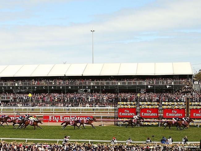 Rekindling edges out Johannes Vermeer in a thrilling finish in the Melbourne Cup.