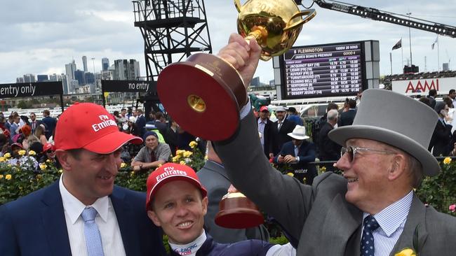 Trainer Rob Hickmott, jockey Kerrin McEvoy and owner Lloyd Williams with the spoils of Almandin’s victory in the Melbourne Cup.